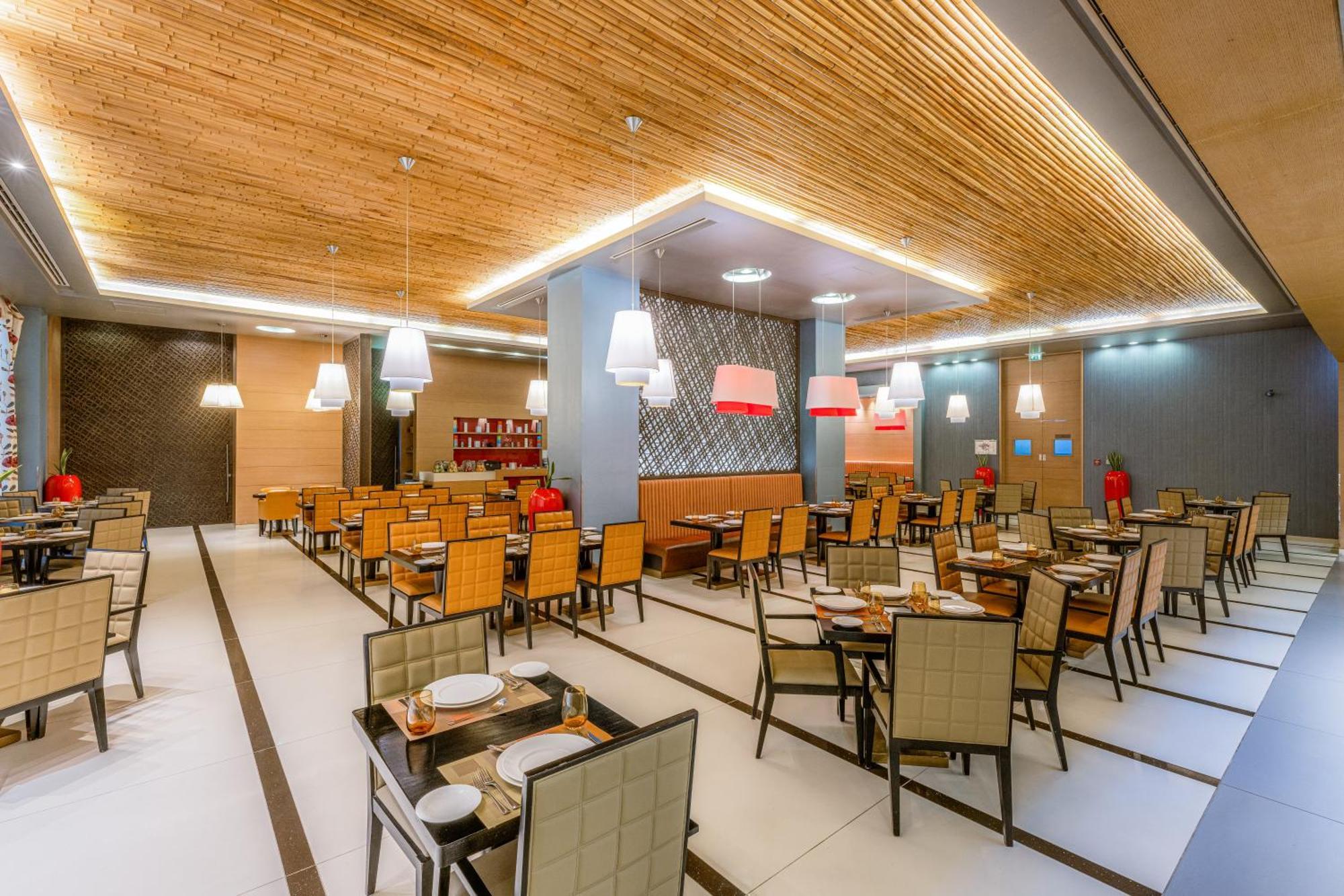 فندق هيلي ريحان باي روتانا العين المظهر الخارجي الصورة Restaurant