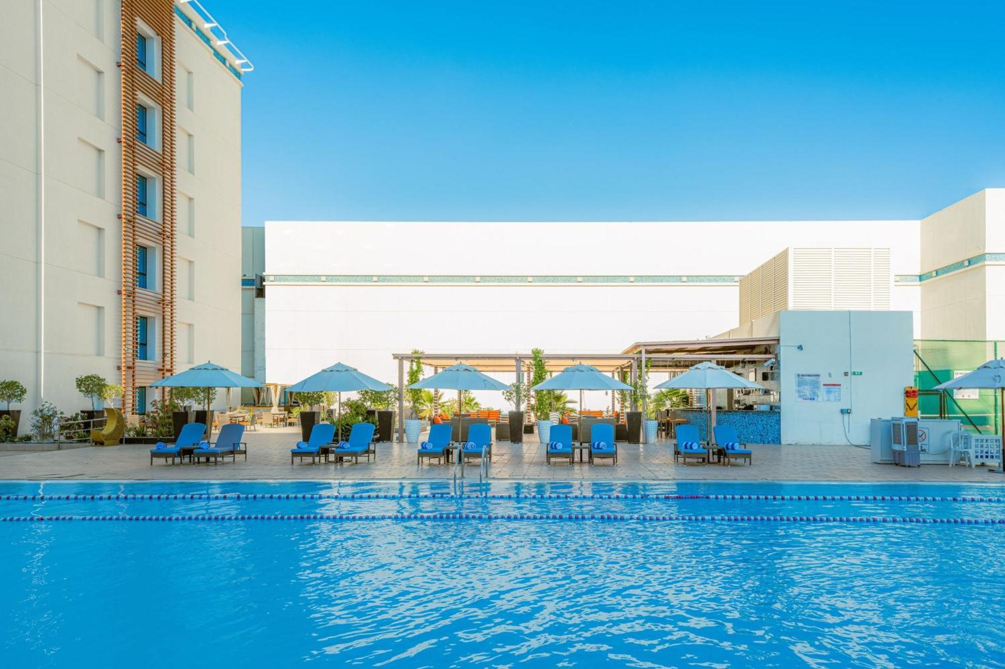 فندق هيلي ريحان باي روتانا العين المظهر الخارجي الصورة The swimming pool at the hotel