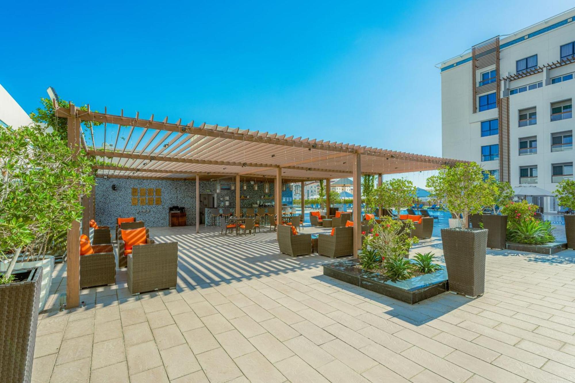 فندق هيلي ريحان باي روتانا العين المظهر الخارجي الصورة Rooftop bar